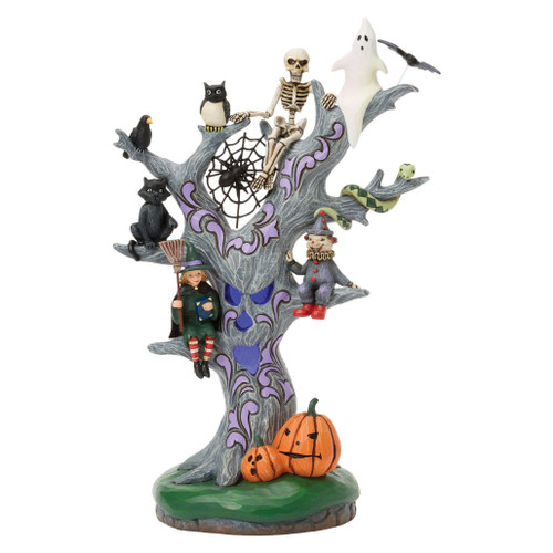 Jim Shore LED Halloween tree figurine featuring a ghost, skeleton, black cat, owl, crow, snake, pumpkins, and colorful folk-art accents.
Hand-painted stone resin Heartwood Creek Halloween tree with color-changing LED face and intricate purple rosemaling.
Battery-operated Halloween tabletop decoration with whimsical spooky characters and illuminated tree trunk.