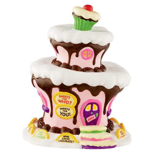 Illuminated Department 56 Who-Ville Sweet Shop porcelain village building shaped like a frosted cake with cupcake topper.
Grinch Village candy shop featuring chocolate icing details, pastel walls, colorful windows, and candy-inspired accents.
USB-powered collectible village building measuring 8.35 inches tall.