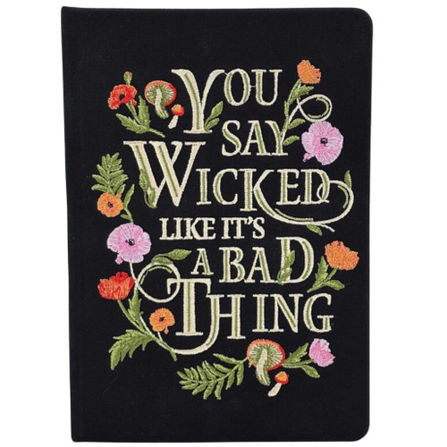 Embroidered cloth-covered Wicked journal featuring the phrase "You Say Wicked Like It's a Bad Thing."
Black journal cover decorated with colorful embroidered flowers and botanical accents.
Journal with 192 ruled paper pages inspired by the Wicked film.