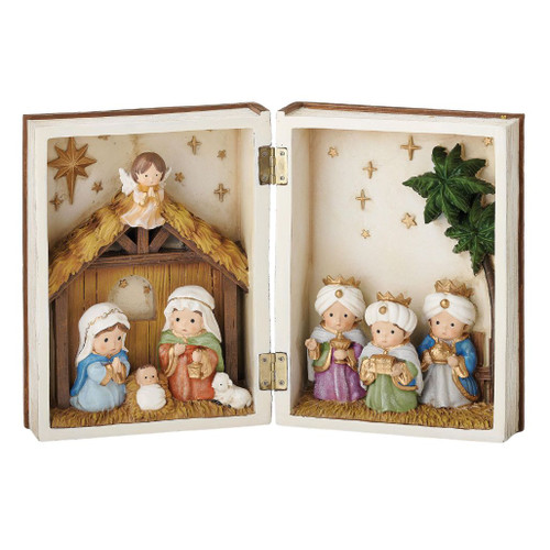 Kids Nativity book figurine with Mary, Joseph, baby Jesus, Three Wise Men, angel, sheep, stars, and palm trees.

Polymer Nativity scene designed as an open book, measuring 8.5 inches high by 12.5 inches wide.

Open-book Christmas Nativity decoration with softly styled Holy Family figures, Wise Men, stable, angel, and gold stars.