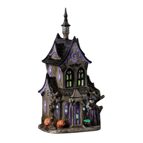 16-inch lighted haunted house with witch, cauldron, jack-o'-lanterns, and gothic windows.

Resin Halloween haunted house with dark exterior, purple trim, green windows, and crooked rooflines.

Tall lighted haunted house decoration with witch, pumpkins, gnarled trees, and spooky architectural details.