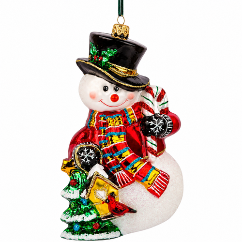 Huras Family 6-inch handblown glass Snowman with Christmas Tree ornament.

Polish glass snowman ornament with black top hat, red sweater, colorful scarf, glittered candy cane, and Christmas tree.

Glittered snowman Christmas ornament beside a green tree and snow-covered birdhouse with a red cardinal.