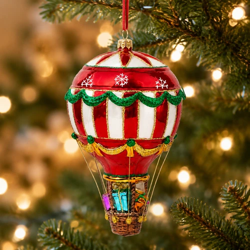 Huras Family Balloon Delivery 7.5-inch handblown glass hot air balloon Christmas ornament.

Red and white hot air balloon ornament with green garlands, gold accents, snowflakes, and hanging basket.

Hand-painted glass Christmas balloon ornament with colorful wrapped presents inside a brown basket.