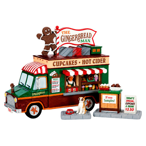 Lemax The Gingerbread Man Set of 3 featuring a gingerbread-themed food truck, dog, and decorative signs.
Resin Christmas village table accent with a large gingerbread man sign and colorful holiday treats.
Non-electrical Lemax holiday display accessory measuring approximately 4.8 inches tall.