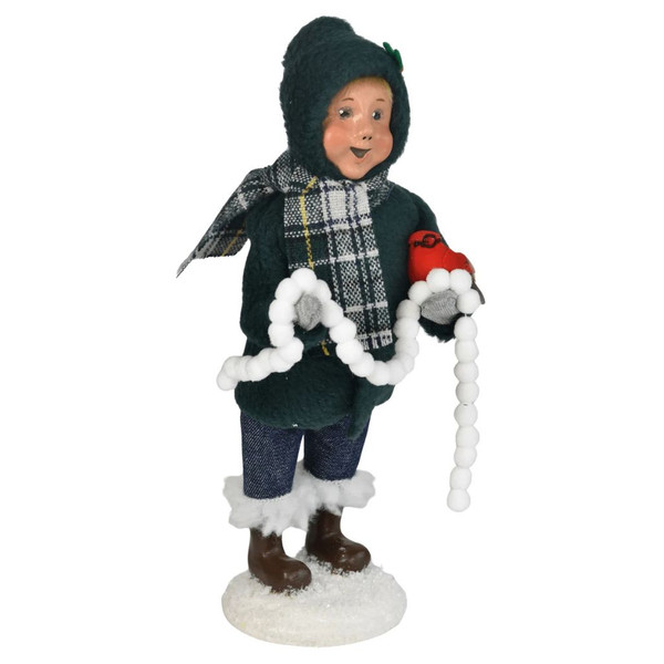 Handcrafted Byers' Choice Boy with Cardinals Christmas Caroler holding bright red cardinals.
Ten-inch collectible Caroler with hand-painted clay head and custom fabric clothing.
Festive holiday figurine featuring a young boy and symbolic cardinals for seasonal displays.
