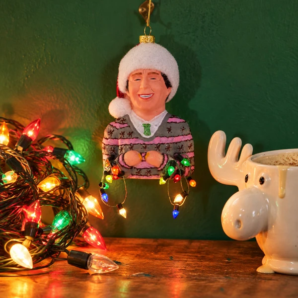 Cody Foster Chevy Chase Ornament – glass Christmas ornament styled in a fun, eclectic home scene