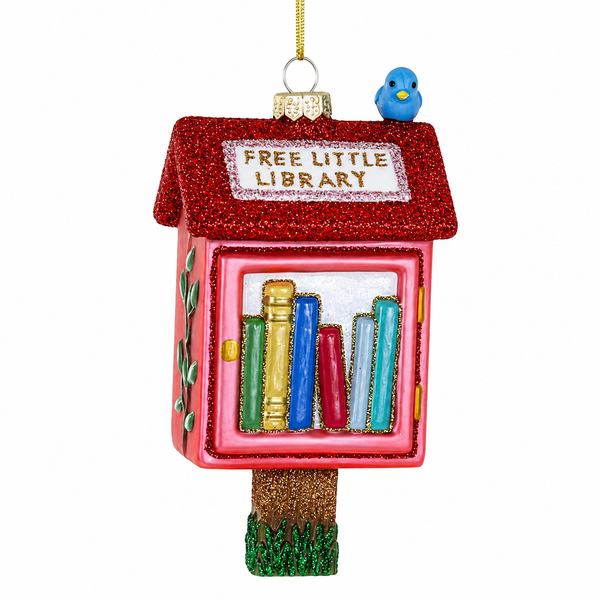 Cody Foster Free Little Library glass ornament with pink box, red glitter roof, books, and blue bird.
Five-inch glass ornament shaped like a neighborhood Free Little Library with colorful book details.
Book-themed Christmas ornament hanging from a gold cord with glitter accents and library sign.