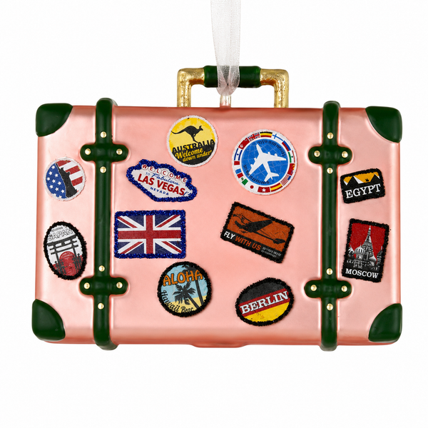 Glass Bon Voyage suitcase ornament with pink body and green trim.
Travel Christmas ornament decorated with colorful destination stickers.
3.5 inch glass suitcase ornament with white hanging ribbon.