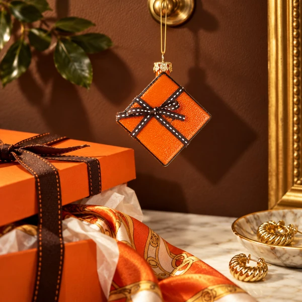 Cody Foster The Orange Box Glass Ornament – glass Christmas ornament styled in a fun, eclectic home scene