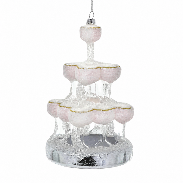 Glass champagne tower ornament with tiered coupe-style glasses and silver base.
Elegant hanging ornament with blush glass details, gold edging, and icy glitter.
6 inch glass Champagne Tower Christmas ornament
