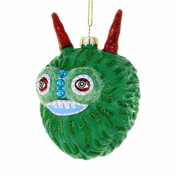 Green friendly monster glass ornament with red horns and wide eyes.
Round green monster hanging ornament with blue grin and shiny blue face accents.
Friendly monster green glass ornament measuring 2.75 x 3 x 4 inches.