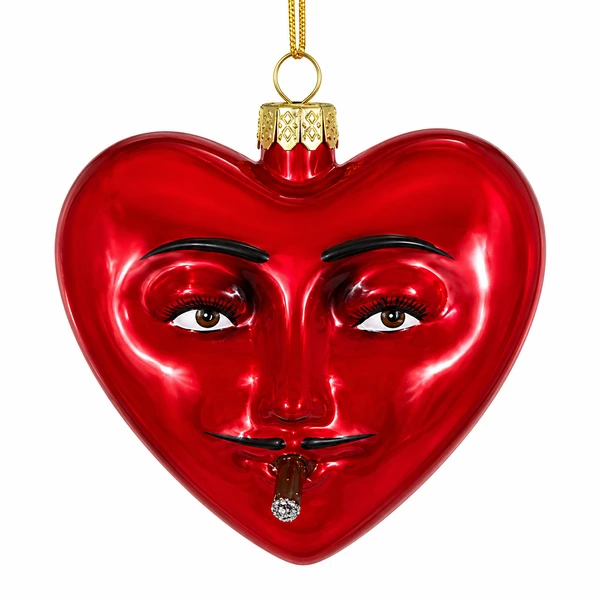 Red glass heart ornament with sculpted face and mustache detail.
Monsieur character ornament with gold cap, hanging cord, and tiny cigar detail.
Glossy red heart-shaped Christmas ornament with expressive eyes and black brows.