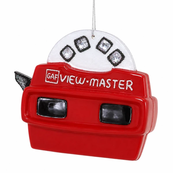Glass View Master ornament with red viewer body, black viewing windows, and silver hanging cord.
Retro toy-inspired Christmas ornament with picture reel detail above the red viewer.
View Master glass ornament measuring 3 x 1.25 x 3 inches.