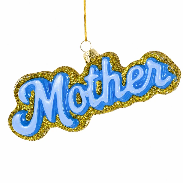 Glass Mother ornament with blue script lettering and gold glitter border.
Hanging word ornament spelling “Mother” with a gold cord.
Mother glass ornament measuring 4.75 x 1 x 2 inches.