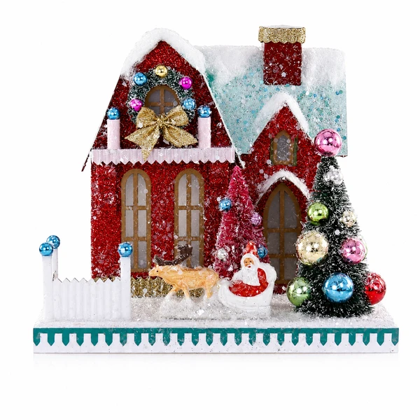 Cardboard Santa’s Ranch Christmas house with snowy roof and red walls.
Vintage-style holiday house with Santa, reindeer, tree, and glitter accents.
8 x 6 x 7.5 inch cardboard Christmas village-style tabletop decoration.
