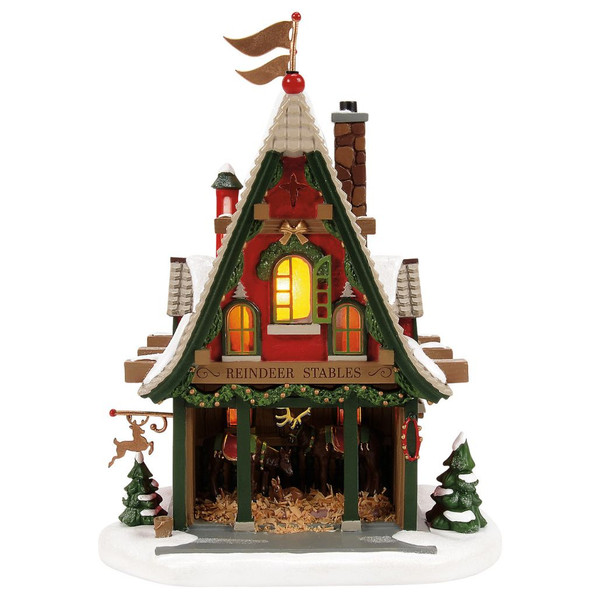 Department 56 50th Reindeer Acres Stable North Pole Village building.
Snowy red reindeer stable with adult reindeer watching over a baby reindeer.
Lighted Department 56 stable made with resin blend materials, 7.99 inches high.