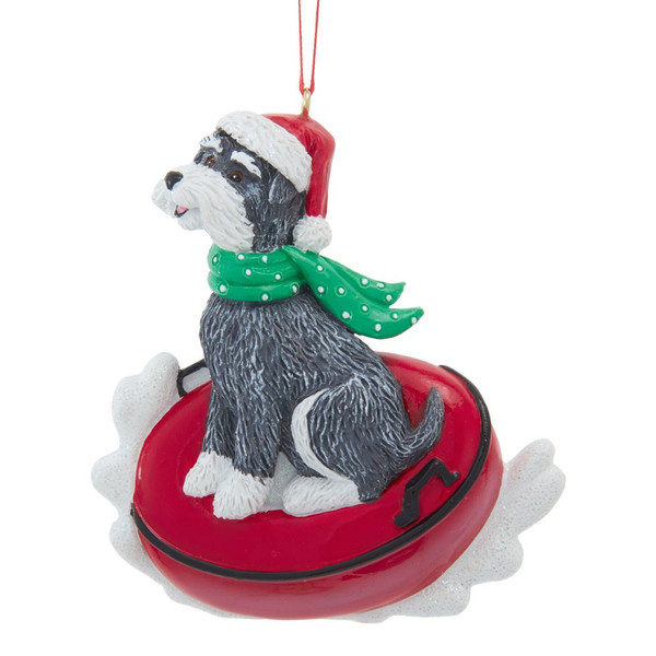 Kurt Adler Schnauzer ornament sitting on a red snow tube with Santa hat and green scarf.
Personalized dog Christmas ornament with black, gray, and white Schnauzer and snowy accents.
3.75-inch resin Schnauzer snow tube ornament with painted mica details.