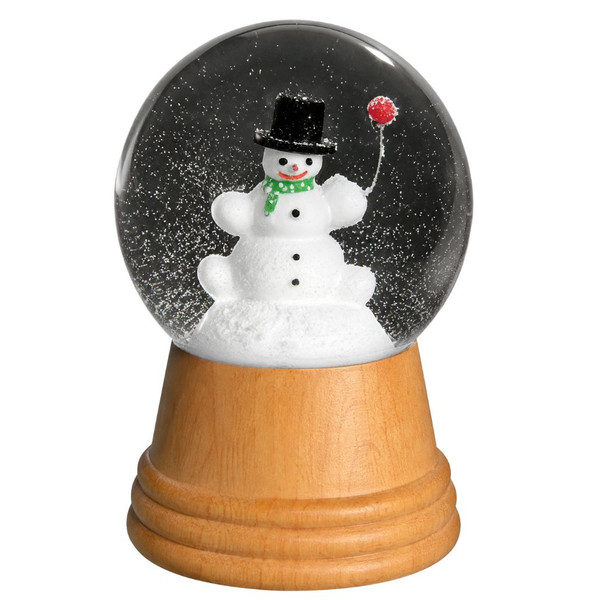 Glass snow globe with snowman inside and wooden base.
Real Viennese snowman snow globe with snowy interior.
5-inch Austrian snow globe made with wood and glass