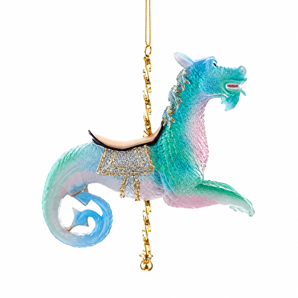 Blue carousel dragon Christmas ornament with pastel aqua and pink coloring.
4-inch resin dragon ornament featuring ornate gold carousel saddle details.
Fantasy-inspired carousel dragon ornament with curled tail and decorative accents.