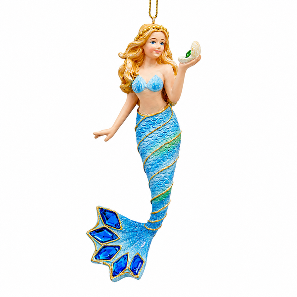 Mermaid ornament with blonde hair, blue scaled tail, and dark blue gem fin accents.
Coastal resin and acrylic mermaid ornament holding a shell with green jewel detail.
5.5-inch blue mermaid Christmas ornament with gold trim and sparkling gems.