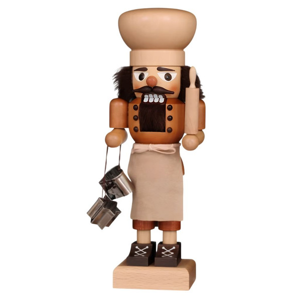 Baker nutcracker with chef’s hat and apron, holding rolling pin and cookie cutters, 10.5 inches tall, wooden.
Front view showing detailed face and attire.
Decorative German Christmas nutcracker for mantel or tabletop.