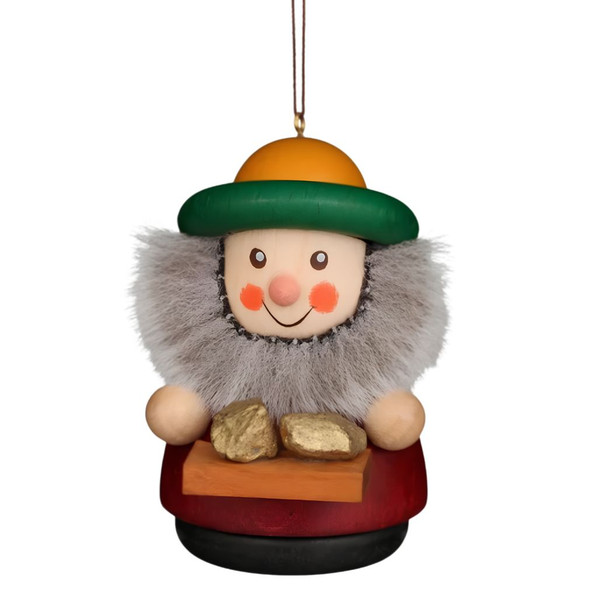 Caspar dwarf hanging ornament with green and yellow hat, gray beard, holding gold nuggets, 2.75 inches tall, wooden.
Front view showing smiling face and colorful outfit.
Decorative German Christmas ornament for tree or display.
