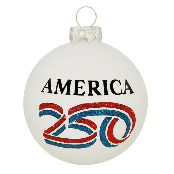 Round glass ornament with America 250™ logo, red, white, and blue ribbon motif, 3.5-inch size, sparkling finish, made in North Carolina, USA.