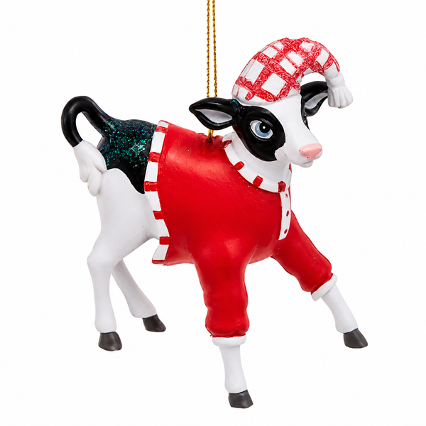 Black and white cow Christmas ornament wearing red pajamas.
Resin pajama party cow ornament with plaid sleep hat and blue eye detail.
3.15-inch whimsical farm animal ornament hanging from a gold cord.