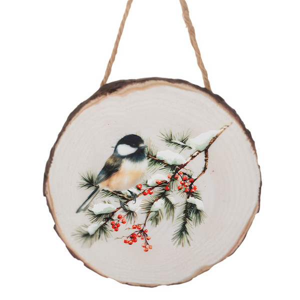 Chickadee wood slice Christmas ornament with snowy evergreen branches and red berries.
Round resin ornament with natural wood slice look and jute hanging cord.
Rustic bird ornament featuring a chickadee perched on winter greenery.