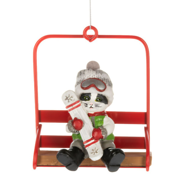 Cat ornament seated on a red chair lift holding ski gear.
Polyresin and polyester cat Christmas ornament with goggles and winter hat.
Alpine holiday ornament featuring a cat on a bright red ski lift chair.