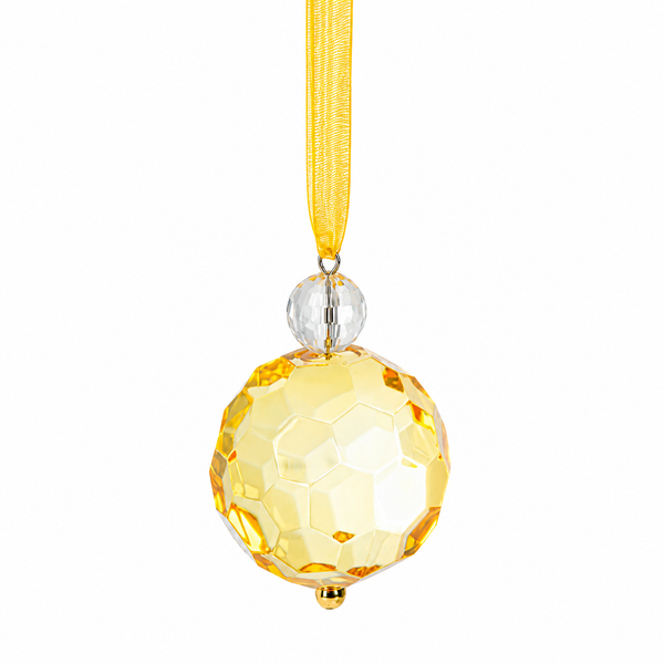Gold faceted acrylic bauble ornament hanging from a gold ribbon.
Small gold crystal-look Christmas ornament with clear bead accent.
Acrylic gold bauble ornament, 1 1/2" W x 2" L.
