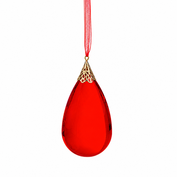 Red teardrop acrylic jewel ornament with gold-tone cap.
Ruby red teardrop Christmas ornament hanging from a red ribbon.
Acrylic teardrop ornament measuring 4 1/2 inches in diameter.