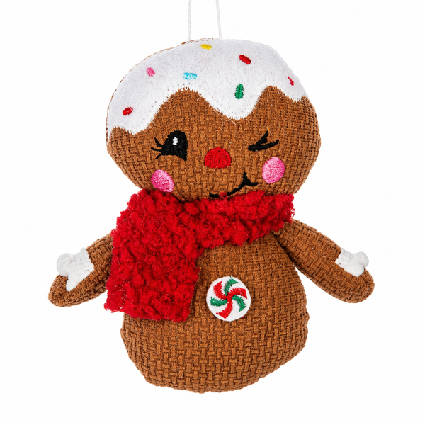 Gingerbread character ornament with red scarf, icing details, and colorful sprinkles.
Soft polyester Christmas ornament featuring a winking gingerbread figure.
Gingerbread holiday ornament measuring approximately 4 x 5.25 inches.