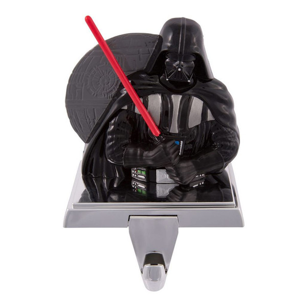 Darth Vader Christmas stocking hanger with red lightsaber and Death Star backdrop.
4-inch stocking hanger made from metal and plastic with detailed Star Wars character design.
Decorative Darth Vader mantel stocking holder with silver base and hanging hook.