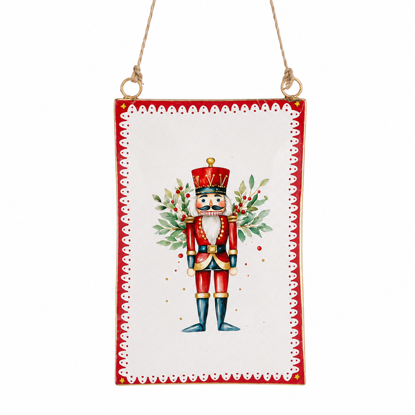 Metal nutcracker ornament with red border and attached hanging cord.
Rectangular Christmas ornament featuring a red nutcracker with greenery accents.
Nutcracker Characters Fantasy Ornament in metal, measuring 3.25 x 5.25 inches.