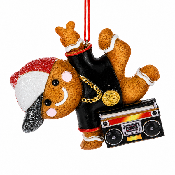 Hip hop gingerbread ornament wearing a Santa hat, black outfit, and gold chain.
Resin gingerbread Christmas ornament posed upside down with a colorful boombox.
Music-themed gingerbread ornament measuring 3.5 x 3.25 inches with red hanging ribbon.