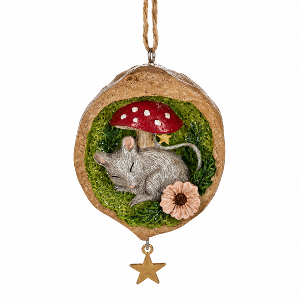 Mouse ornament nestled inside a walnut shell with textured green moss.
Resin Christmas ornament with red mushroom, flower accent, and hanging star.
Woodland mouse ornament measuring 2 1/8 x 3 1/4 inches.