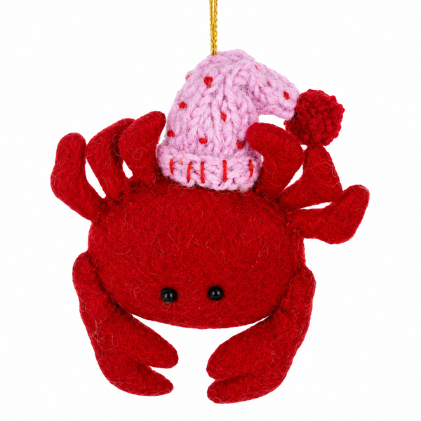 Red wool crab Christmas ornament with raised claws.
Felt crab ornament wearing a pink winter hat with pom-pom.
2 x 6.5 inch wool sea animal ornament with hanging cord.