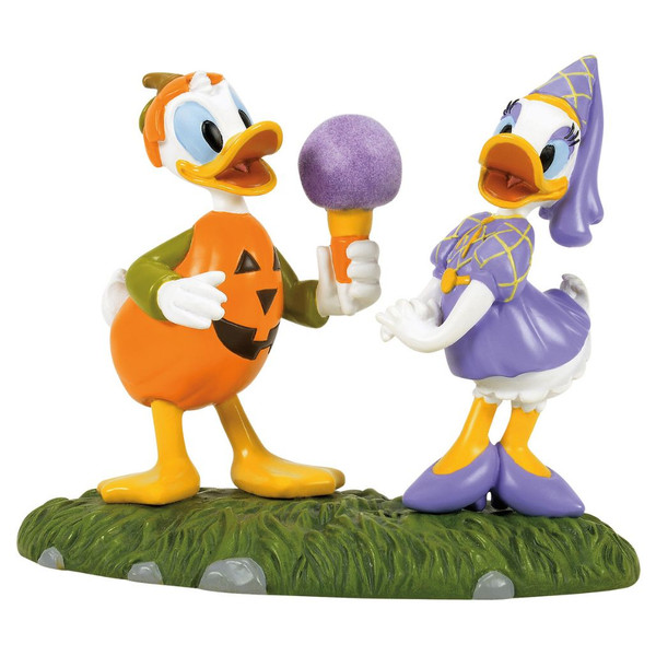 Department 56 Disney Village accessory with Donald and Daisy in Halloween costumes.
Donald wears an orange pumpkin costume and holds purple cotton candy for Daisy.
Polyresin and stone powder Halloween village figure on a grassy base.