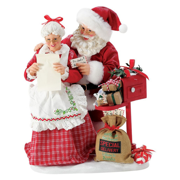 Department 56 Possible Dreams More Letters for the Clauses figurine with Santa and Mrs. Claus reading Christmas letters.
Santa and Mrs. Claus collectible beside a red mailbox, special delivery mail sack, wrapped gifts, and snowy base.
Possible Dreams More Letters for the Clauses figurine measuring 10.5 inches high with PVC, polyresin, polyester, and Clothtique materials.