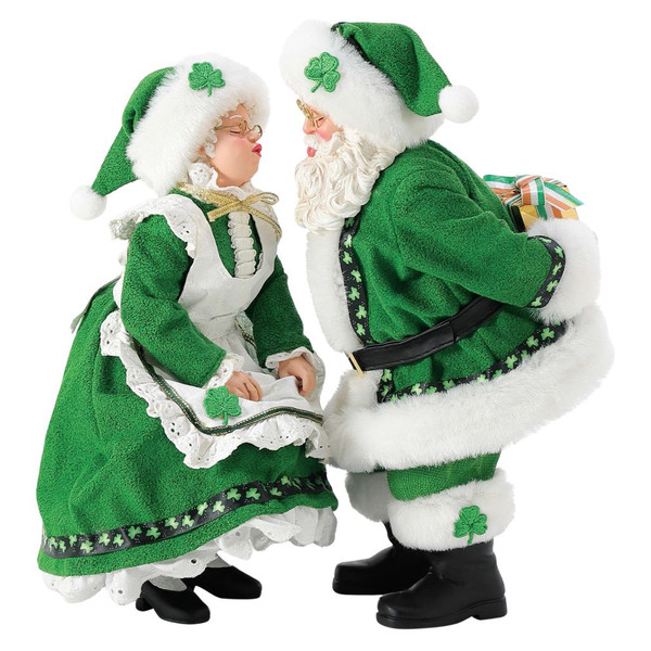 Department 56 Possible Dreams Celtic North Pole Sweethearts figurine with Santa and Mrs. Claus in green outfits.
Santa and Mrs. Claus collectible sharing a kiss with shamrock accents, white fur trim, and hidden gift.
Possible Dreams Celtic North Pole Sweethearts figurine measuring 10 inches high with PVC, polyresin, polyester, and Clothtique materials.