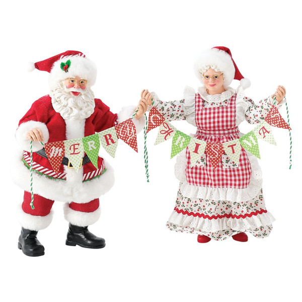 Department 56 Possible Dreams Better Together figurine with Santa and Mrs. Claus holding a Merry Christmas banner.
Santa and Mrs. Claus collectible in red and white holiday outfits with patterned fabric and banner details.
Possible Dreams Better Together figurine measuring 10.5 inches high with PVC, polyresin, polyester, and Clothtique materials.