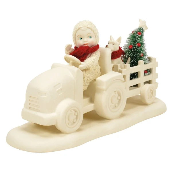 Snowbabies Delivering the Tree figurine with a Snowbaby driving a tractor pulling a wagon carrying a Christmas tree and dog.
Handcrafted porcelain Snowbabies collectible featuring a sisal Christmas tree, festive red scarves, and winter tractor scene.
Holiday figurine showing a Snowbaby delivering a decorated Christmas tree with a dog companion in a wagon.