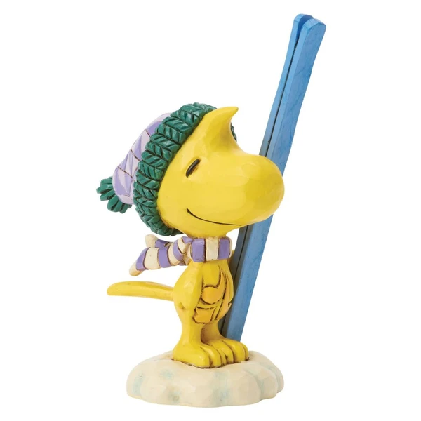 Jim Shore Woodstock with Skis Mini figurine wearing a knit winter hat and striped scarf while holding blue skis.
Hand-painted stone resin Peanuts Woodstock collectible with signature Jim Shore folk-art details.
Mini Woodstock winter figurine featuring skis, snow base, and colorful cold-weather accessories.