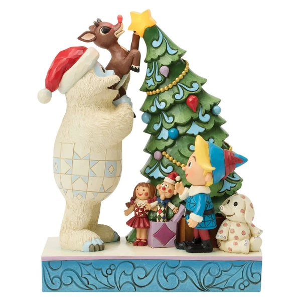 Hand-painted Rudolph Traditions collectible featuring Bumble lifting Rudolph to decorate a Christmas tree.