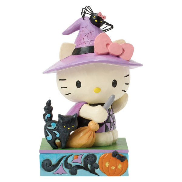 Jim Shore Hello Kitty Witch figurine wearing a purple witch hat and cape while holding a broom beside a black cat.
Hand-painted stone resin Hello Kitty Halloween figurine with folk-art rosemaling and pumpkin accents on the base.
Sanrio collectible featuring Hello Kitty Witch with whimsical Halloween details and Jim Shore craftsmanship.