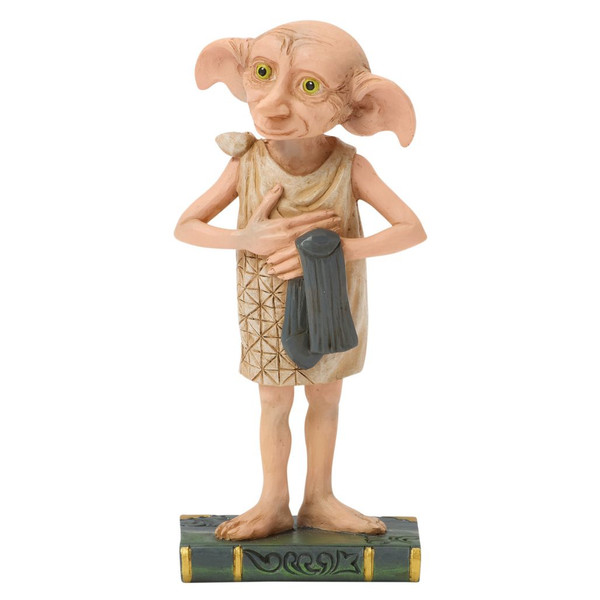 Jim Shore Dobby Personality Pose figurine holding a sock with expressive facial details.

Hand-painted stone resin Harry Potter collectible featuring quilt-inspired folk art textures.

4.33-inch Dobby figurine displayed on a decorative book-style base.
