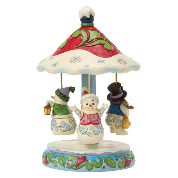 Jim Shore Winter Dancers snowman carousel with three hanging snowmen beneath a snow-covered canopy decorated with folk art patterns.
Hand-painted Heartwood Creek musical snowman carousel featuring rotating figures, colorful winter details, and festive holly accents.
Decorative stone resin Christmas carousel with snowmen, rotating movement, and battery-operated musical feature playing Jingle Bells.