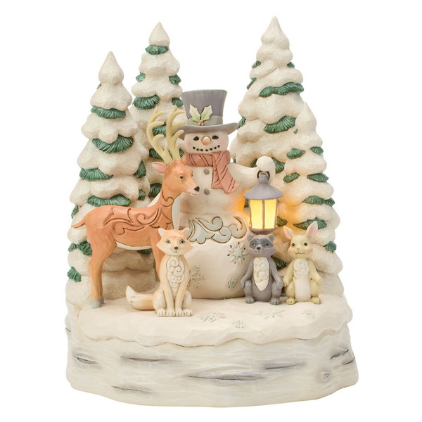 Jim Shore Woodland Snowman with Forest figurine featuring a snowman surrounded by a deer, fox, raccoon, rabbit, and snow-covered pine trees.
Hand-painted stone resin LED Christmas figurine with illuminated lantern and White Woodland styling.
Woodland holiday centerpiece with glowing lantern, evergreen trees, and intricate folk-art details.