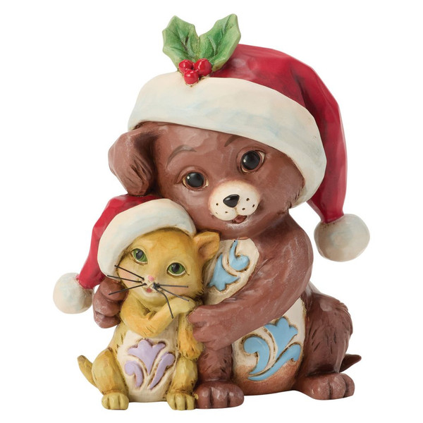 Jim Shore Hugging Dog & Cat Mini Figurine wearing matching Santa hats and embracing.
Hand-painted stone resin dog and cat collectible with Heartwood Creek folk-art detailing.
Mini Christmas figurine featuring a festive puppy and kitten measuring 3.25 inches tall.